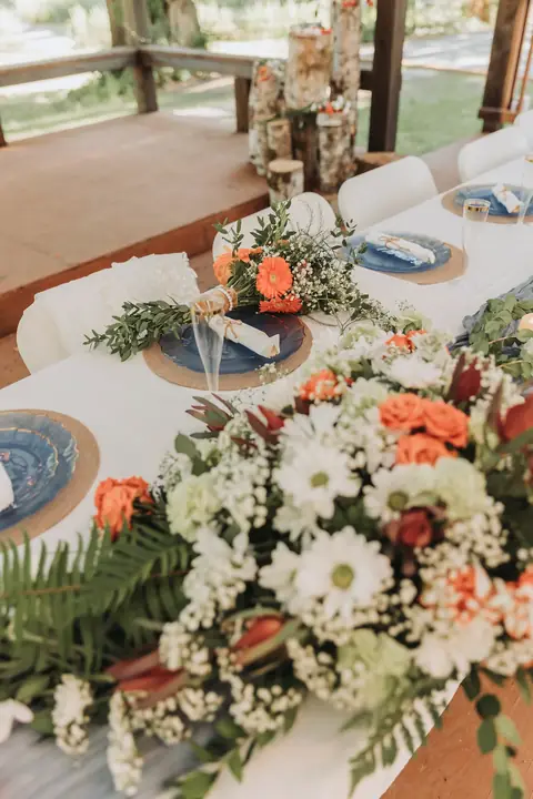 Head table florals and birch logs