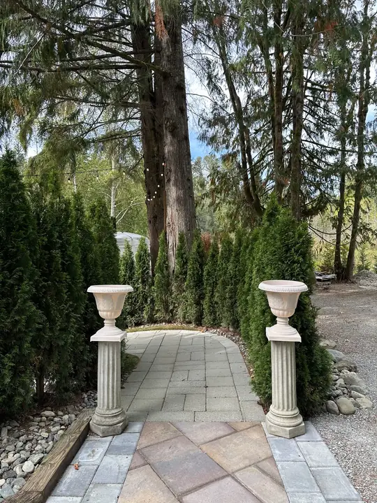 A garden path between two urns
