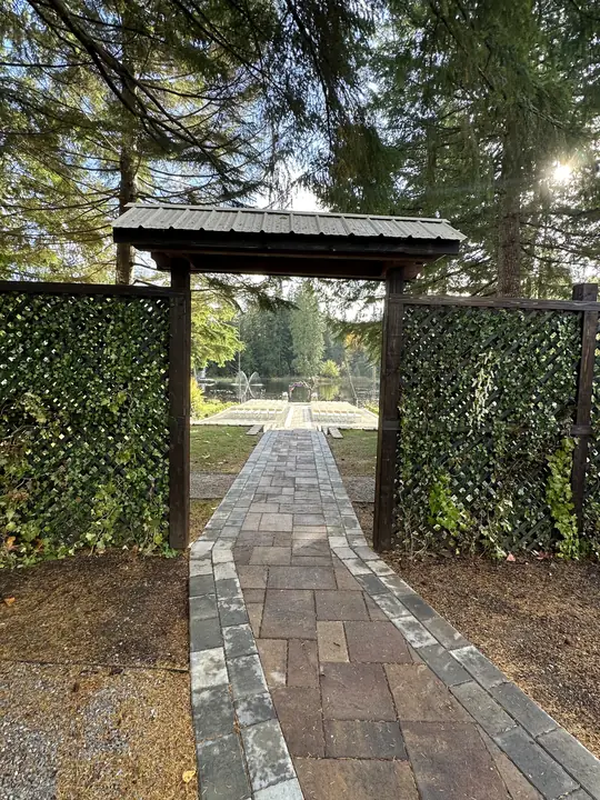 The Ivy Gate and its new roof, open onto the aisle to the lake