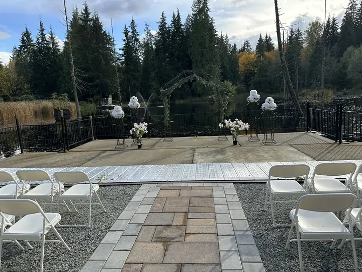 Lakeside ceremony seating, with fountains on the lake