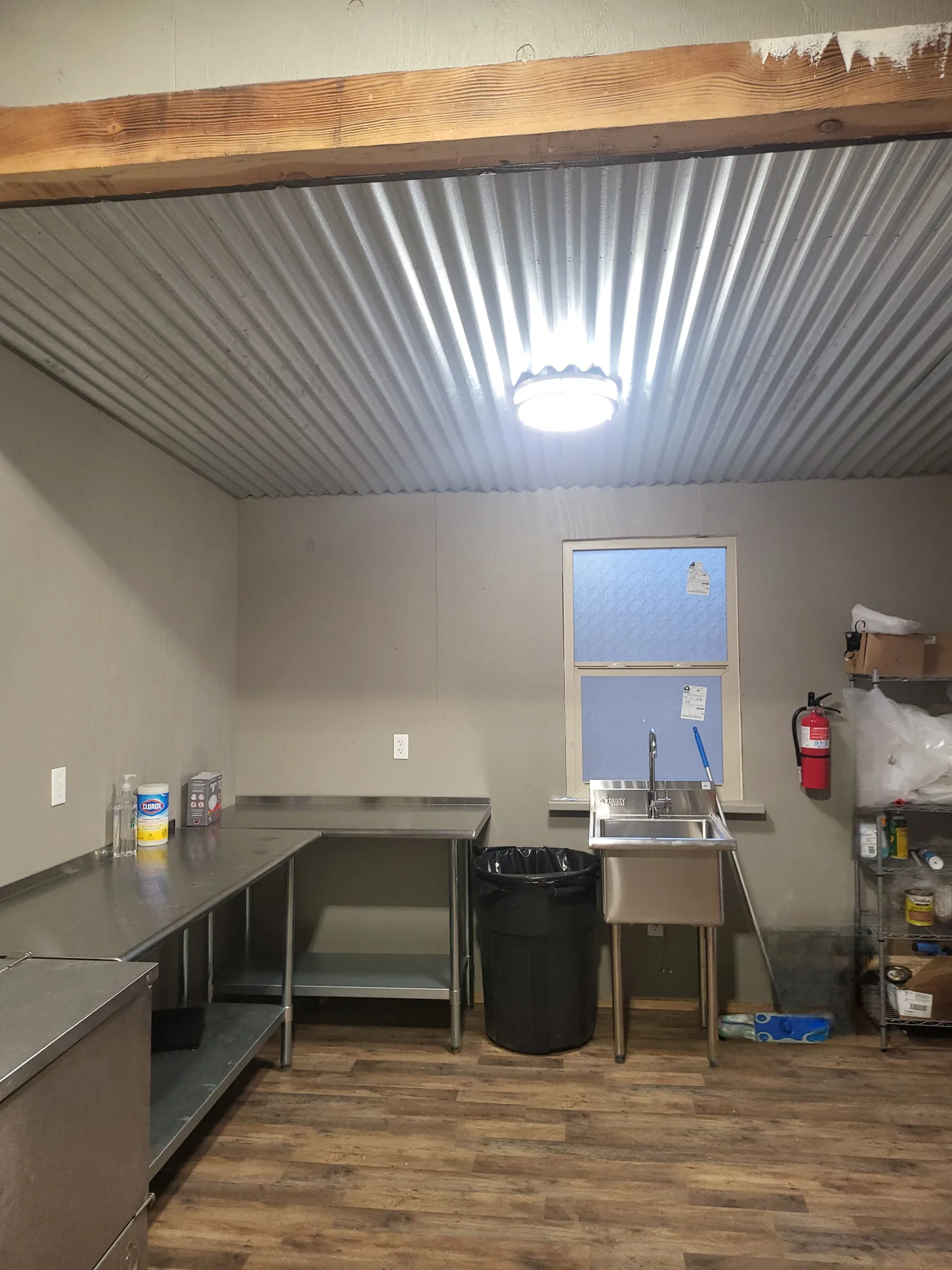 The Catering Room, with stainless steel counters, a utility sink, and room to plate